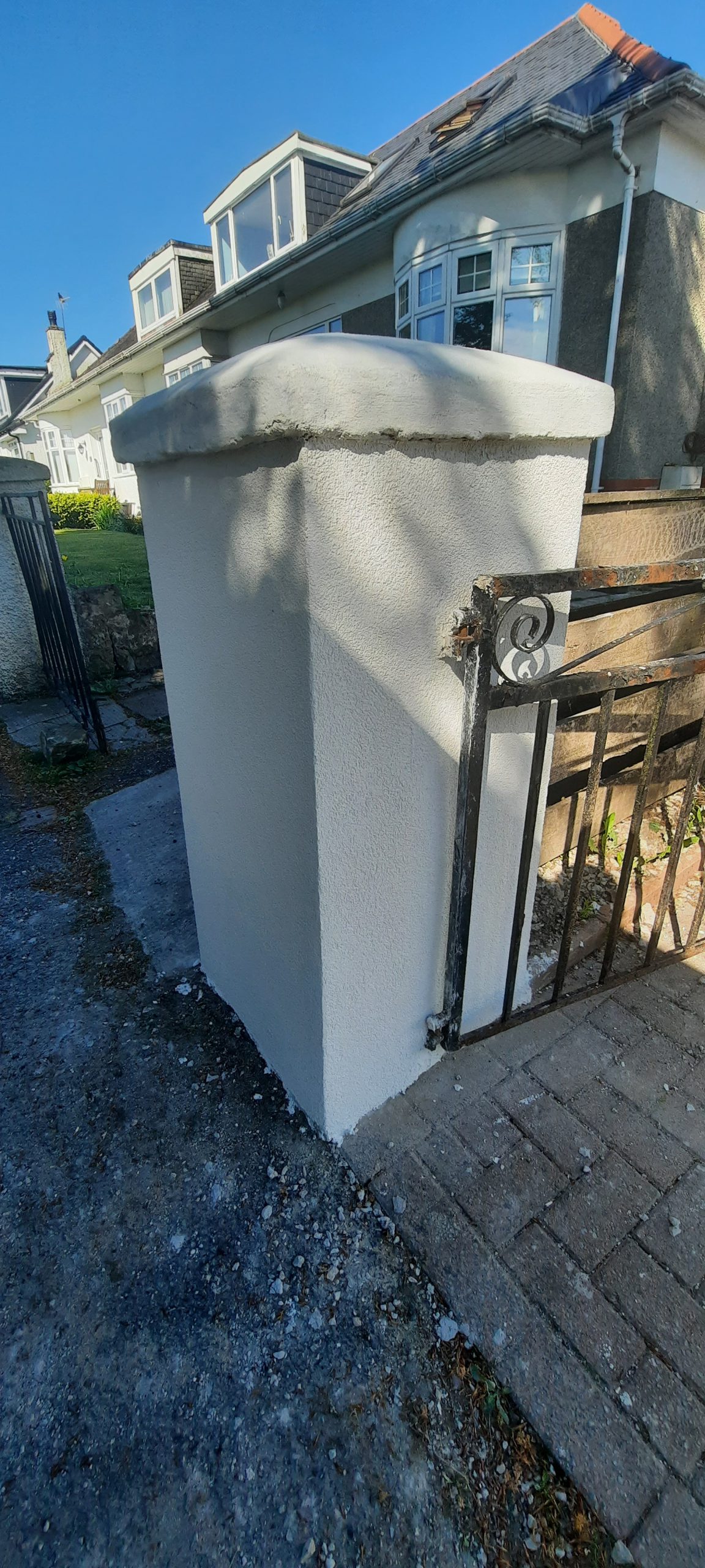 Insulation Edinburgh beneath fresh render on gate pillar