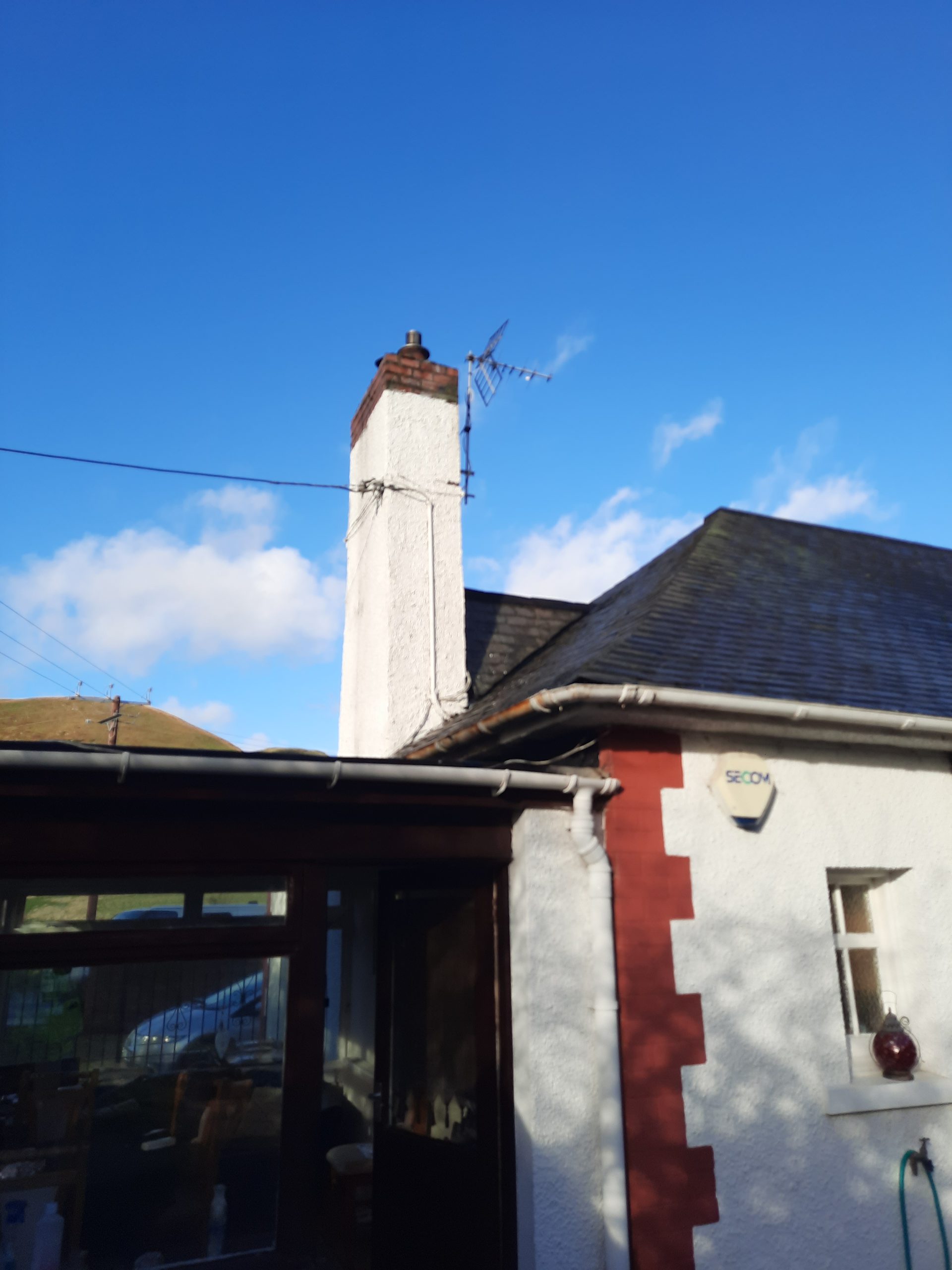 Insulation Edinburgh beneath roughcast on chimney stack