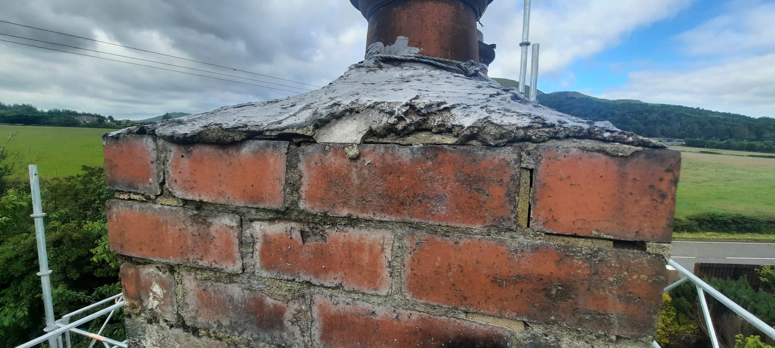 roughcasting Edinburgh repair on weathered brick chimney