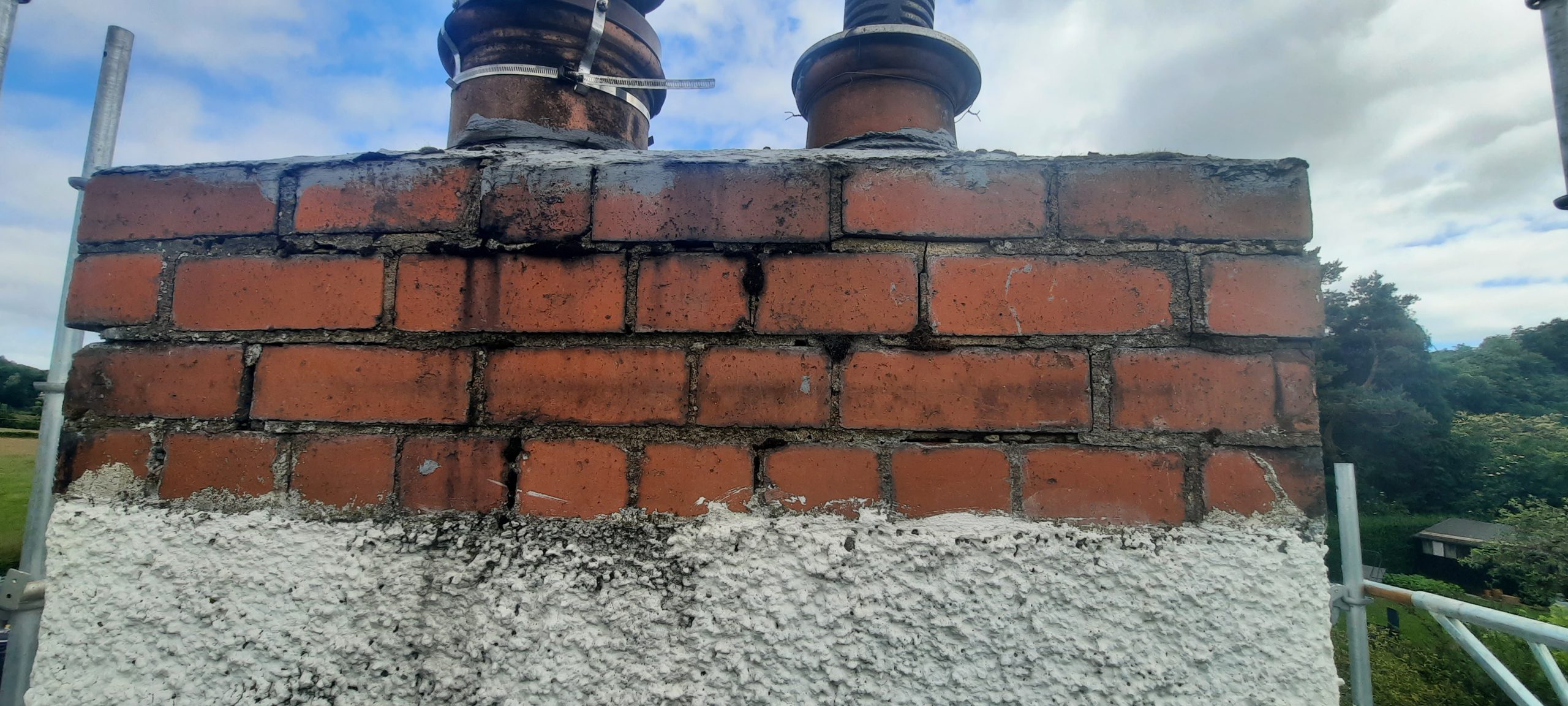 solid wall insulation Edinburgh on chimney with red brick top