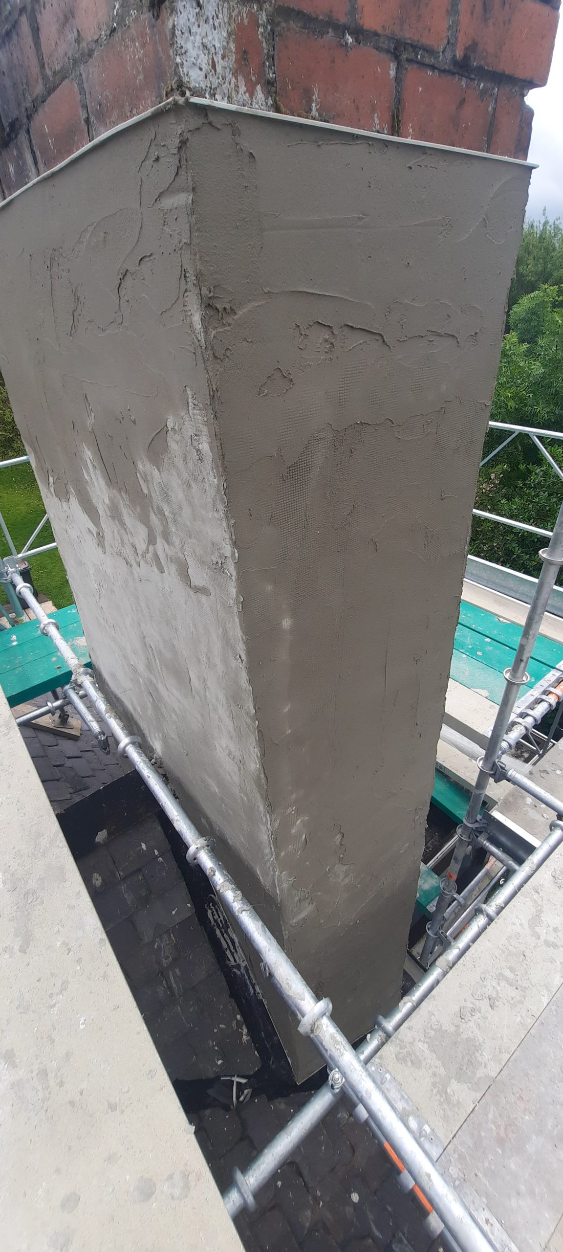 roughcast render repair with new grey coating