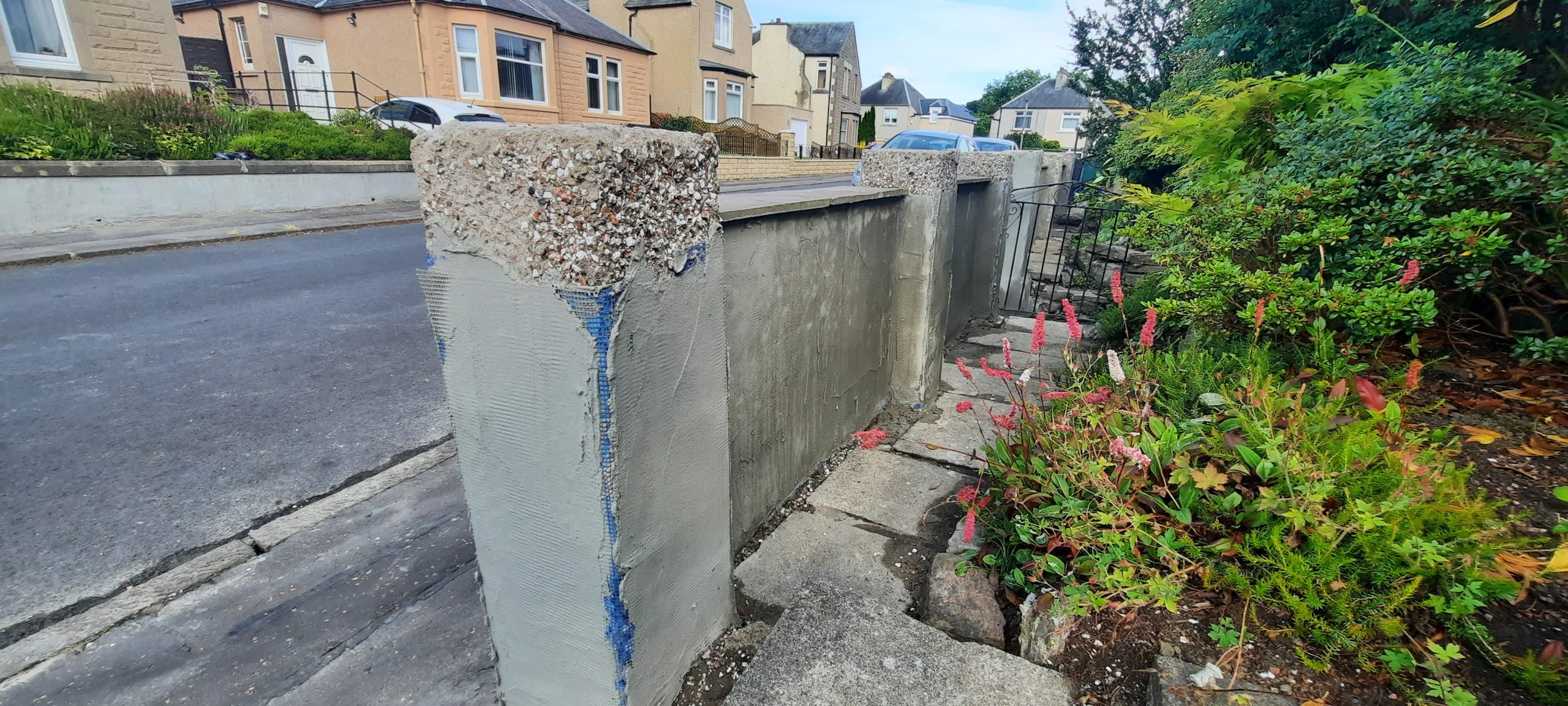 roughcast render Edinburgh repair with blue masking lines