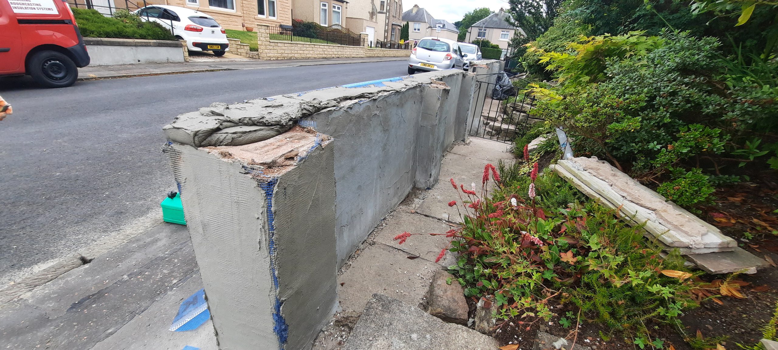 roughcasting Edinburgh on damaged garden wall top