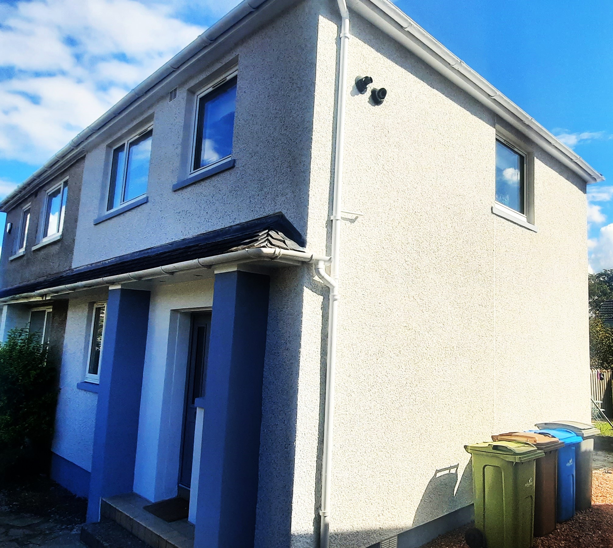 Insulation Edinburgh beneath modern roughcast exterior