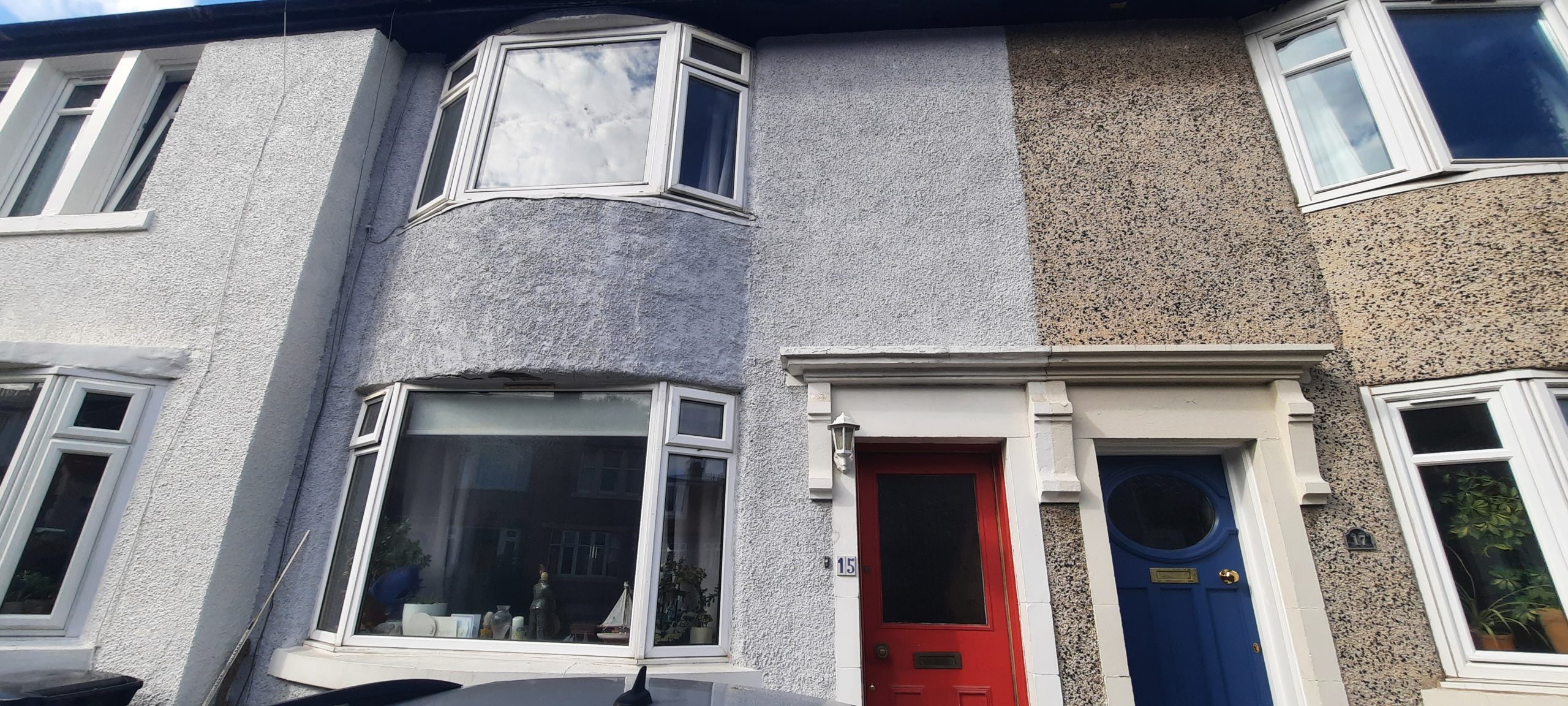 Insulation Edinburgh beneath grey roughcast bay window