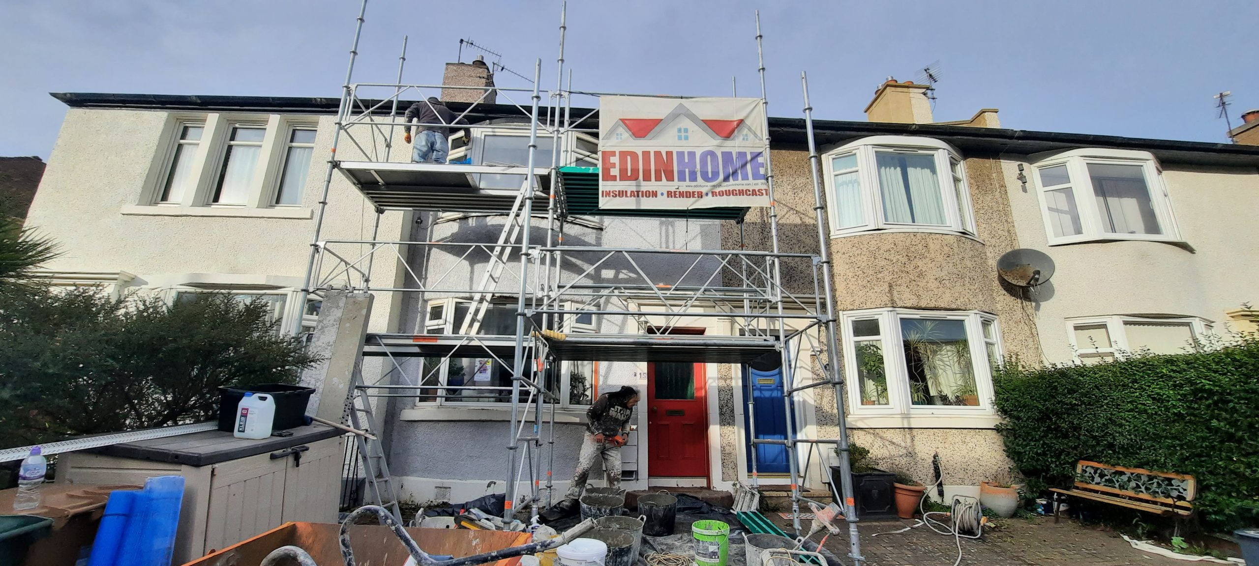 house rendering Edinburgh in front of scaffold tower