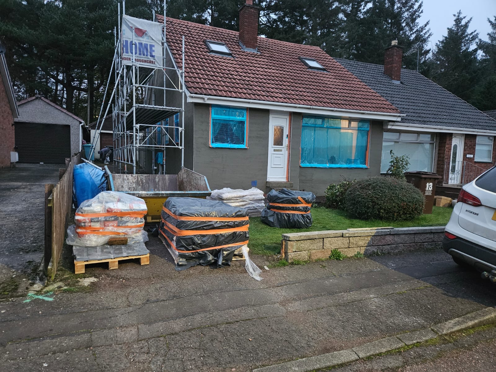 roughcast repair in progress on single-storey home