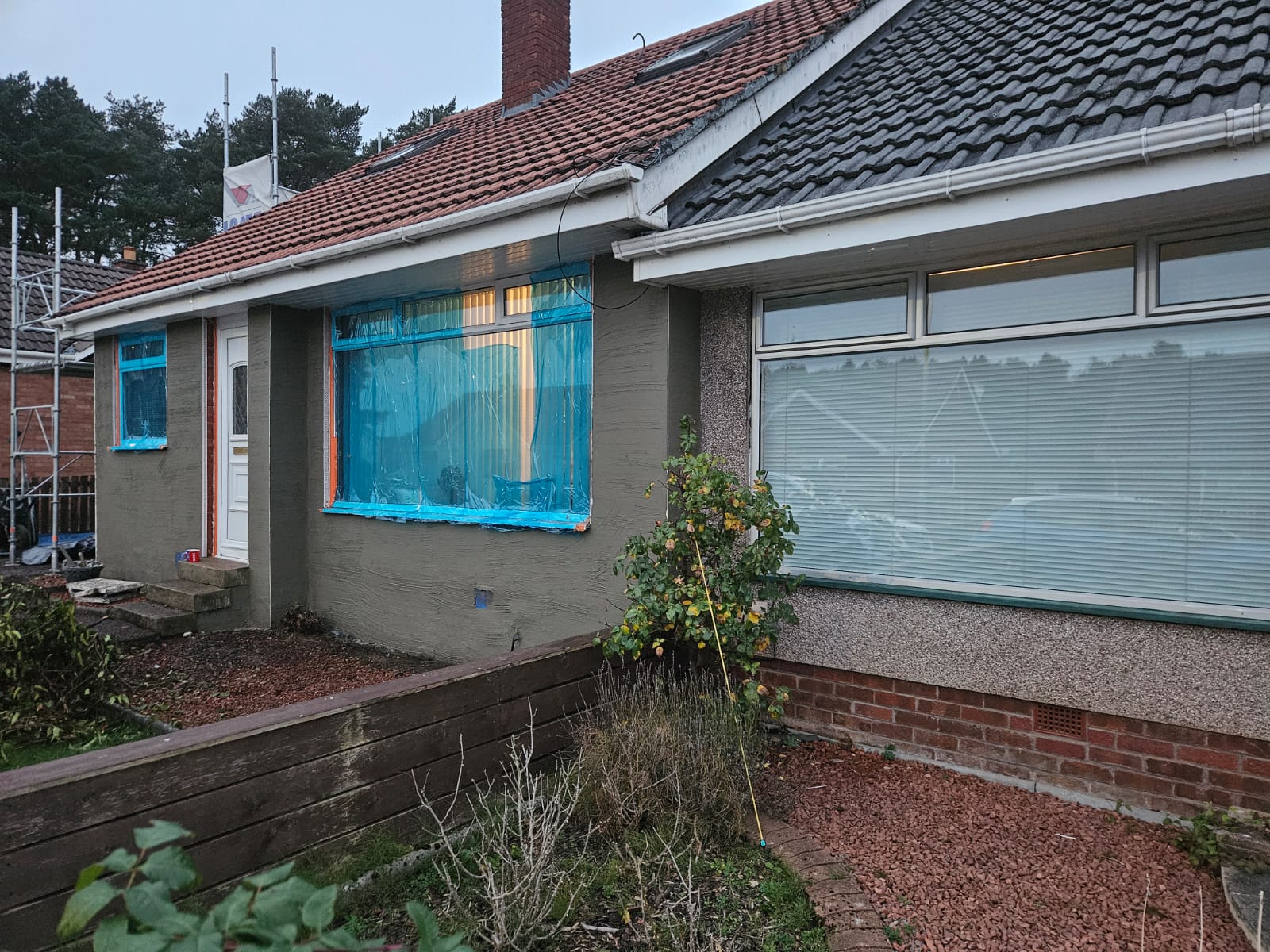 solid wall insulation Edinburgh on cream roughcast home