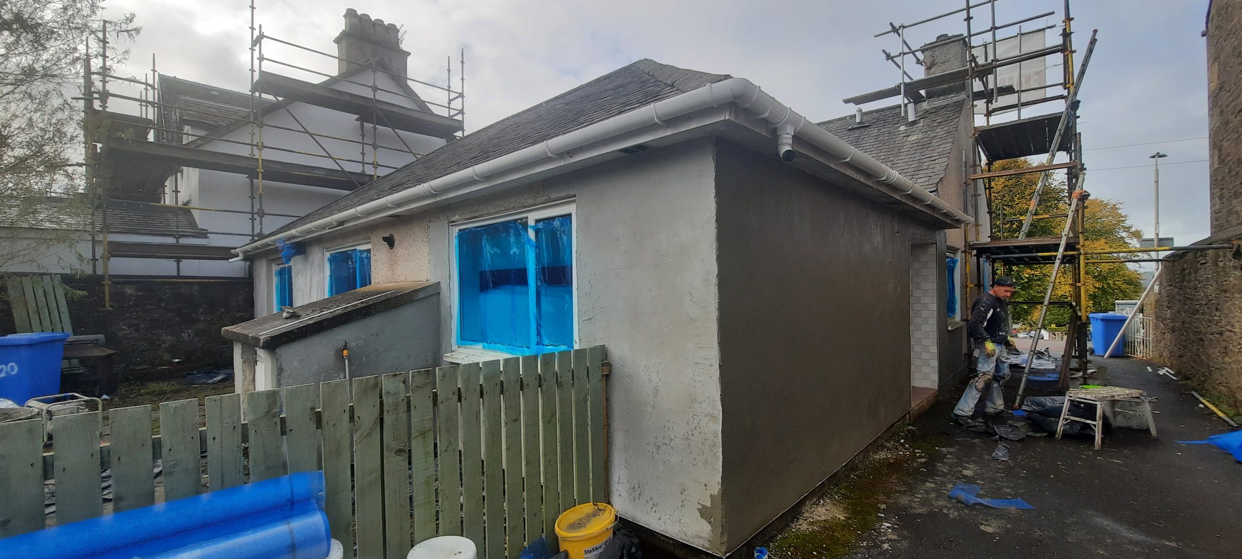 roughcast repair to side elevation under scaffold