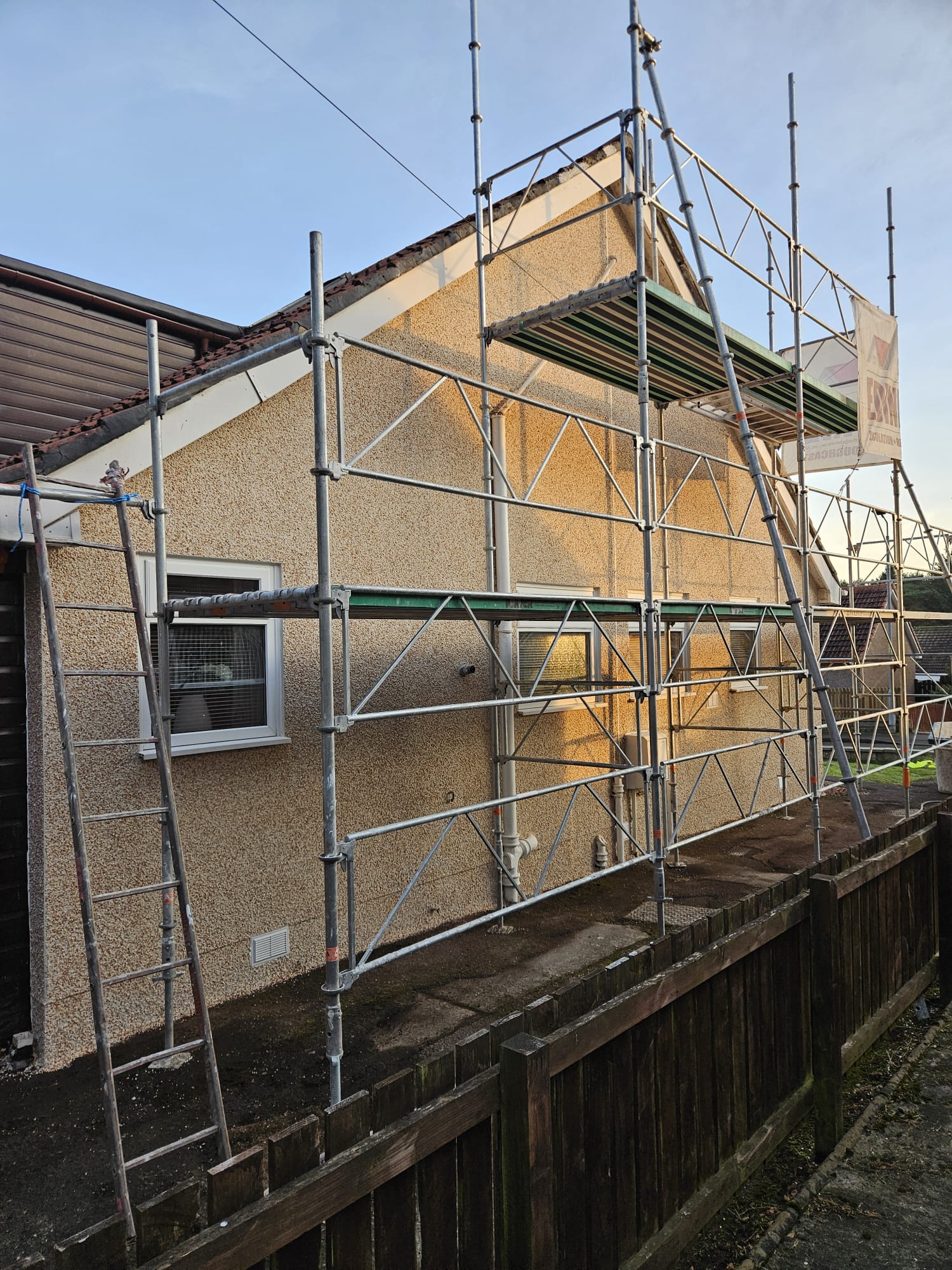 roughcast render repair with scaffold access