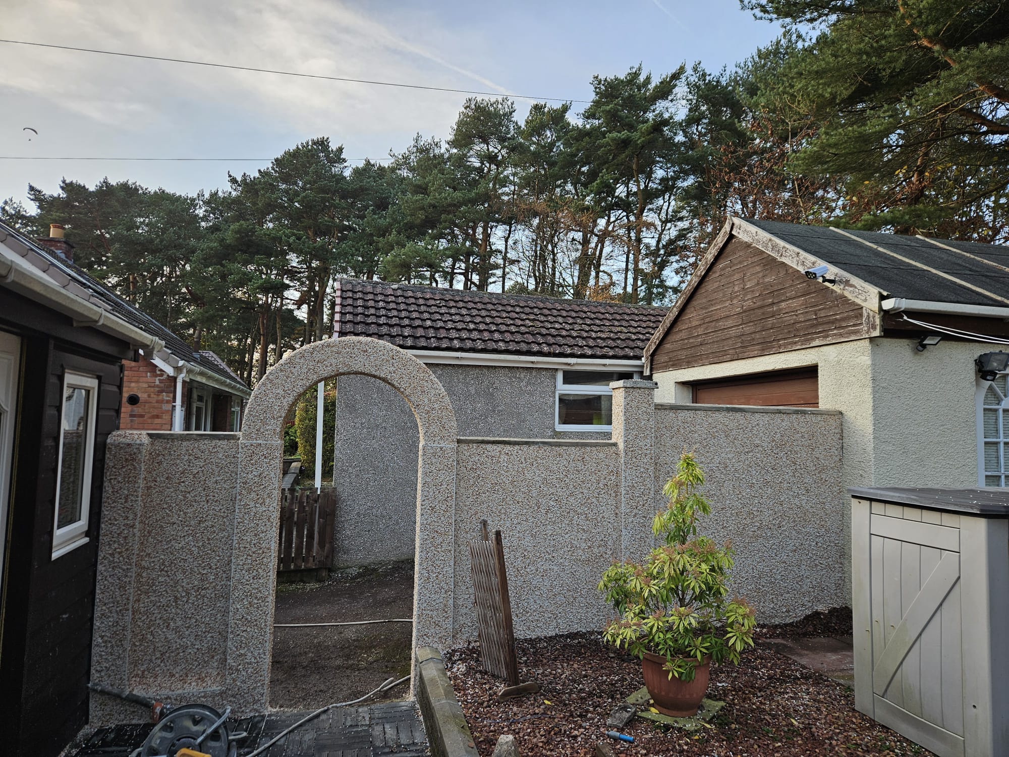 house rendering Edinburgh on courtyard wall with gate