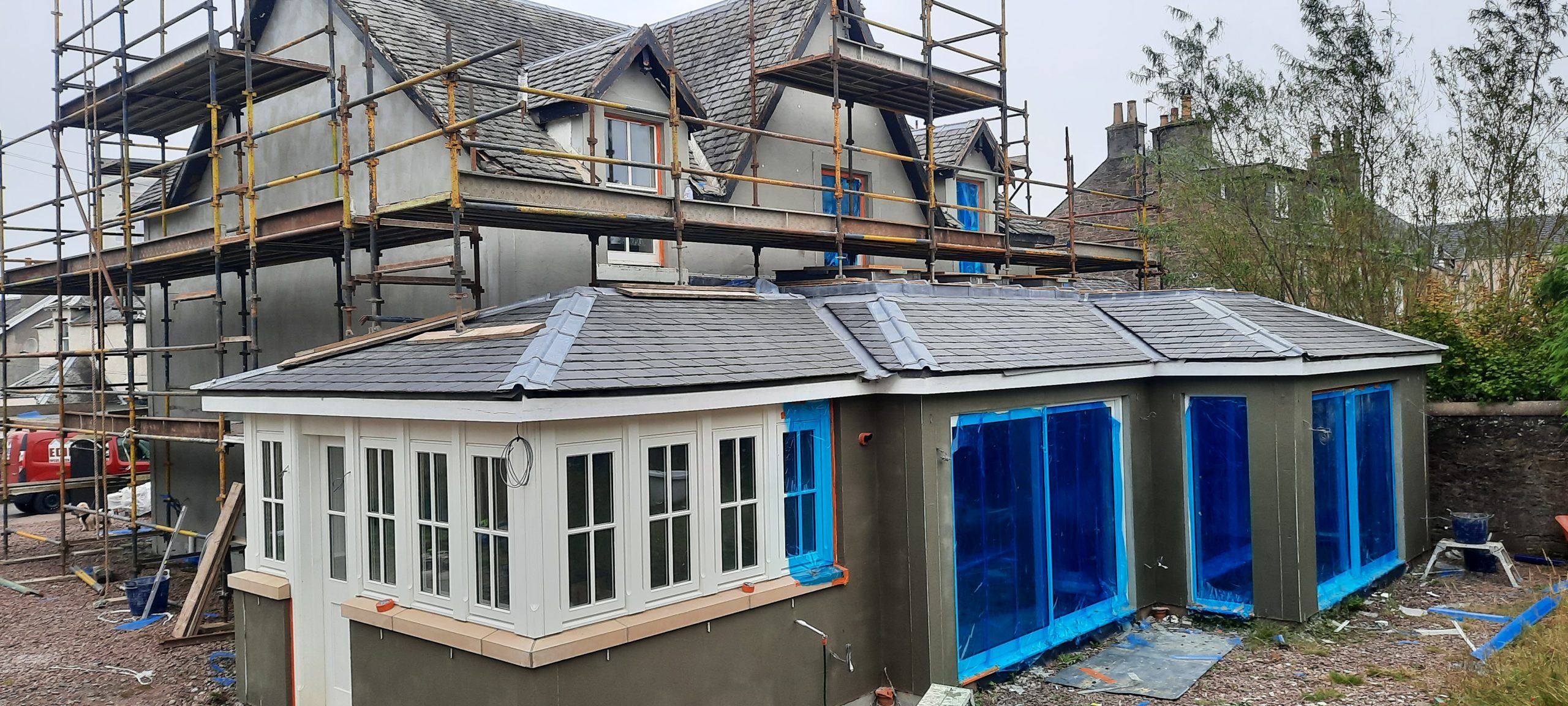 roughcast repair on modern conservatory wall