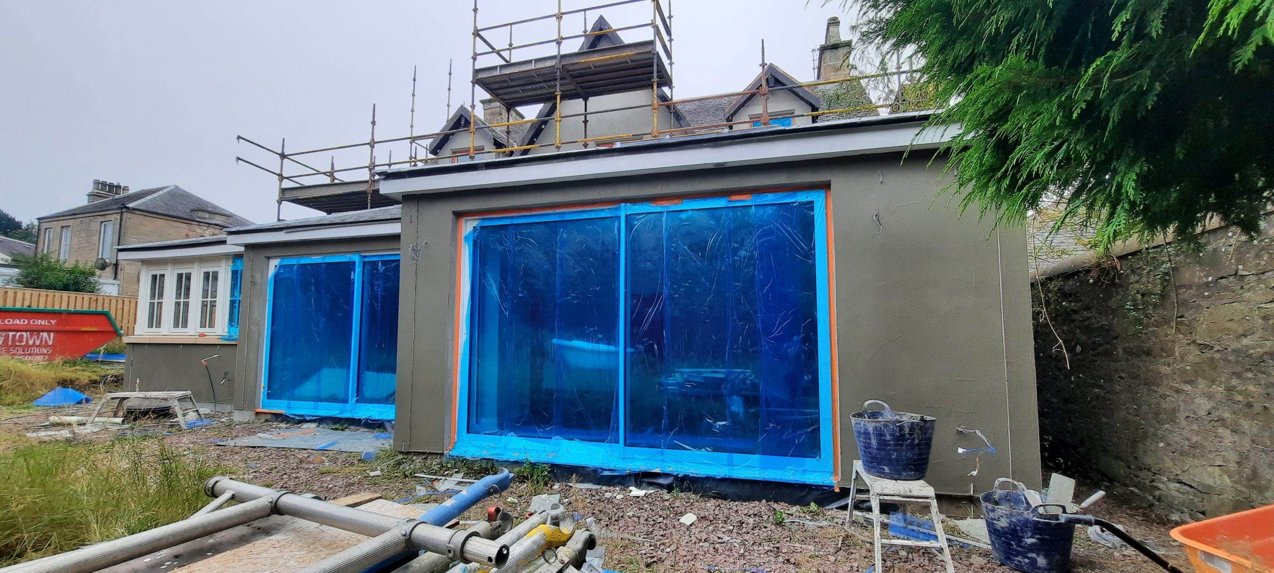 roughcast render repair around wide patio door