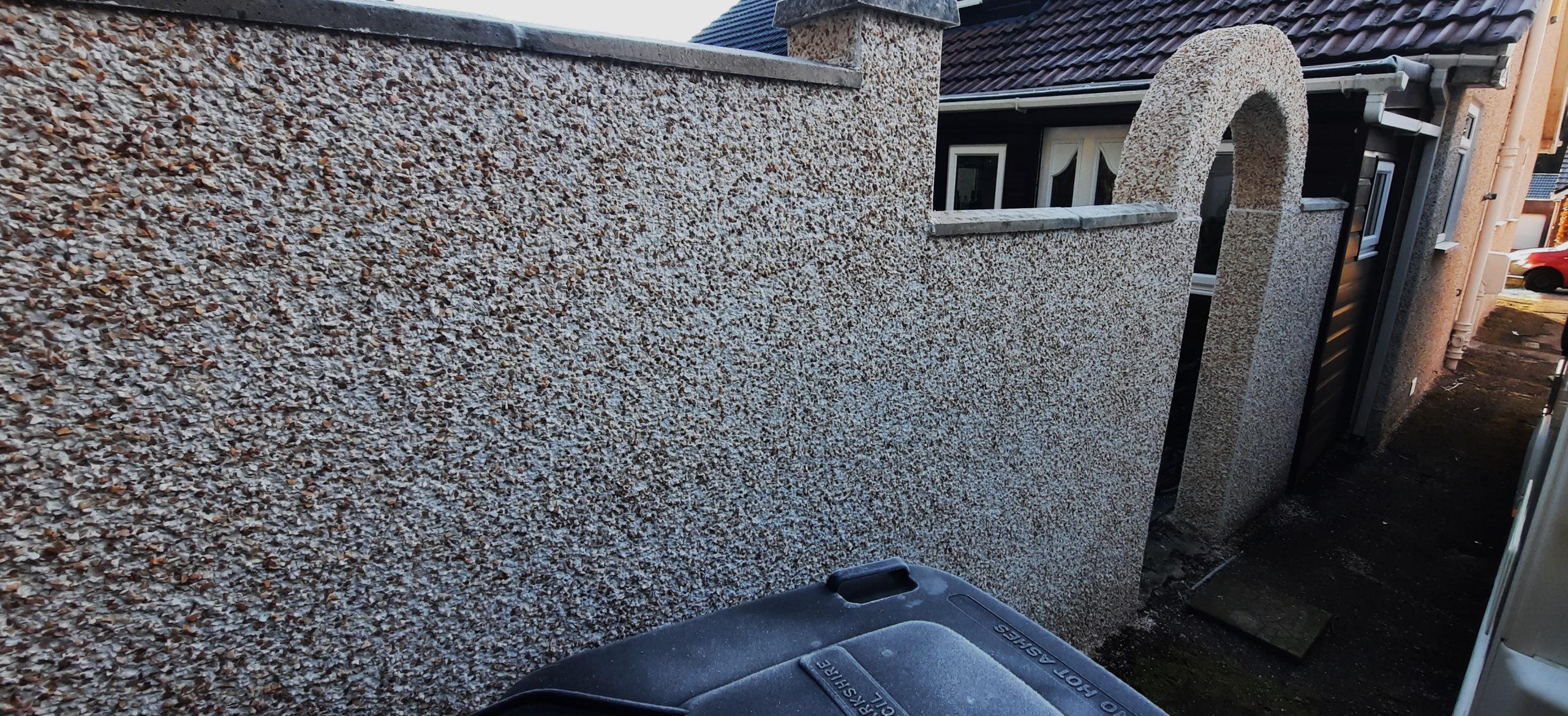 roughcasting Edinburgh on tall gable wall