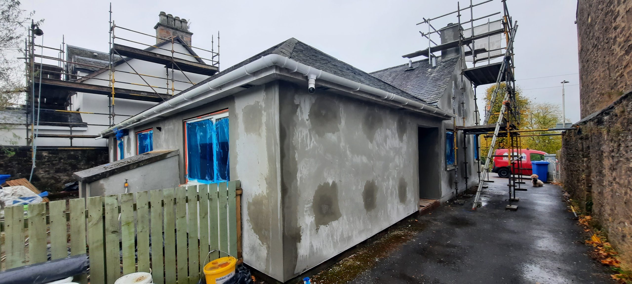 roughcast render repair on rear extension wall