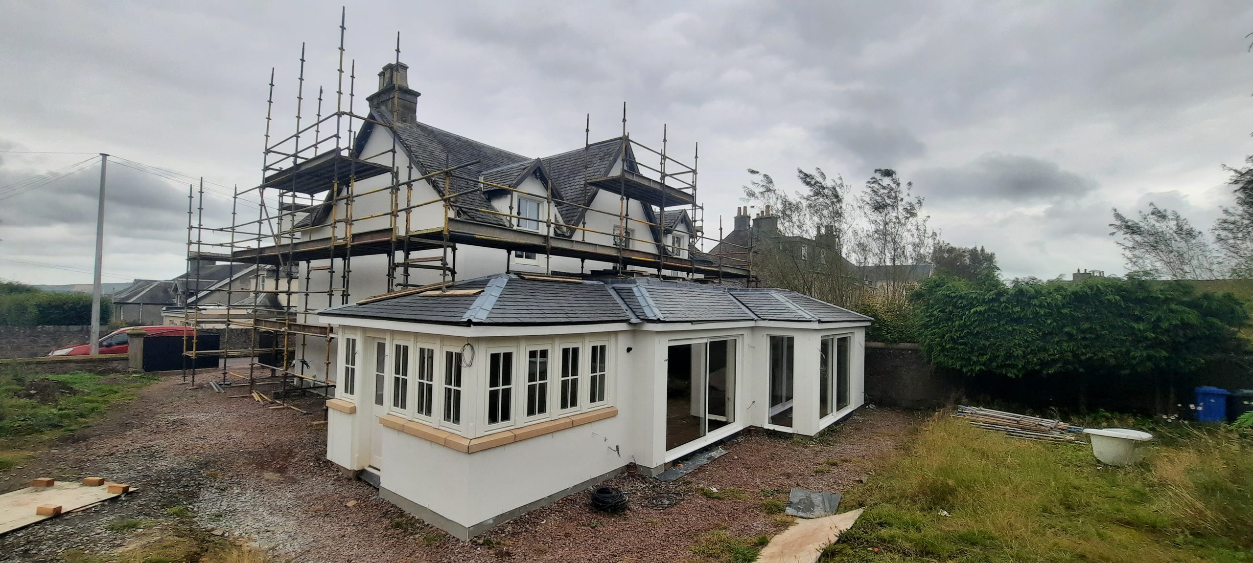 roughcast render Edinburgh beside bright conservatory