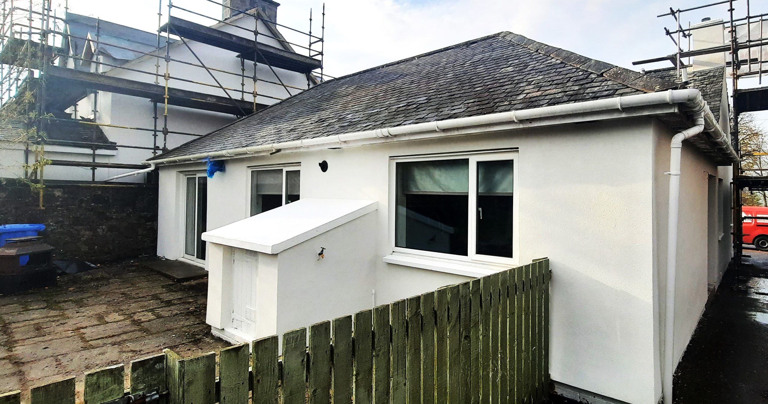 roughcast repair for small white house extension