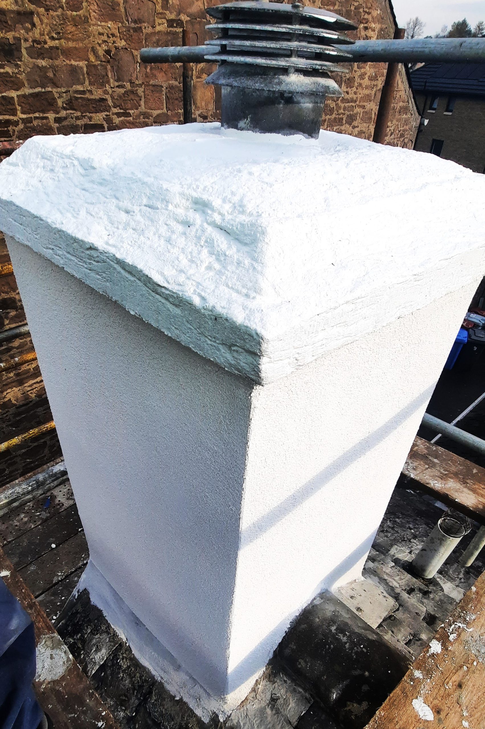 roughcast render repair on top of pillar structure