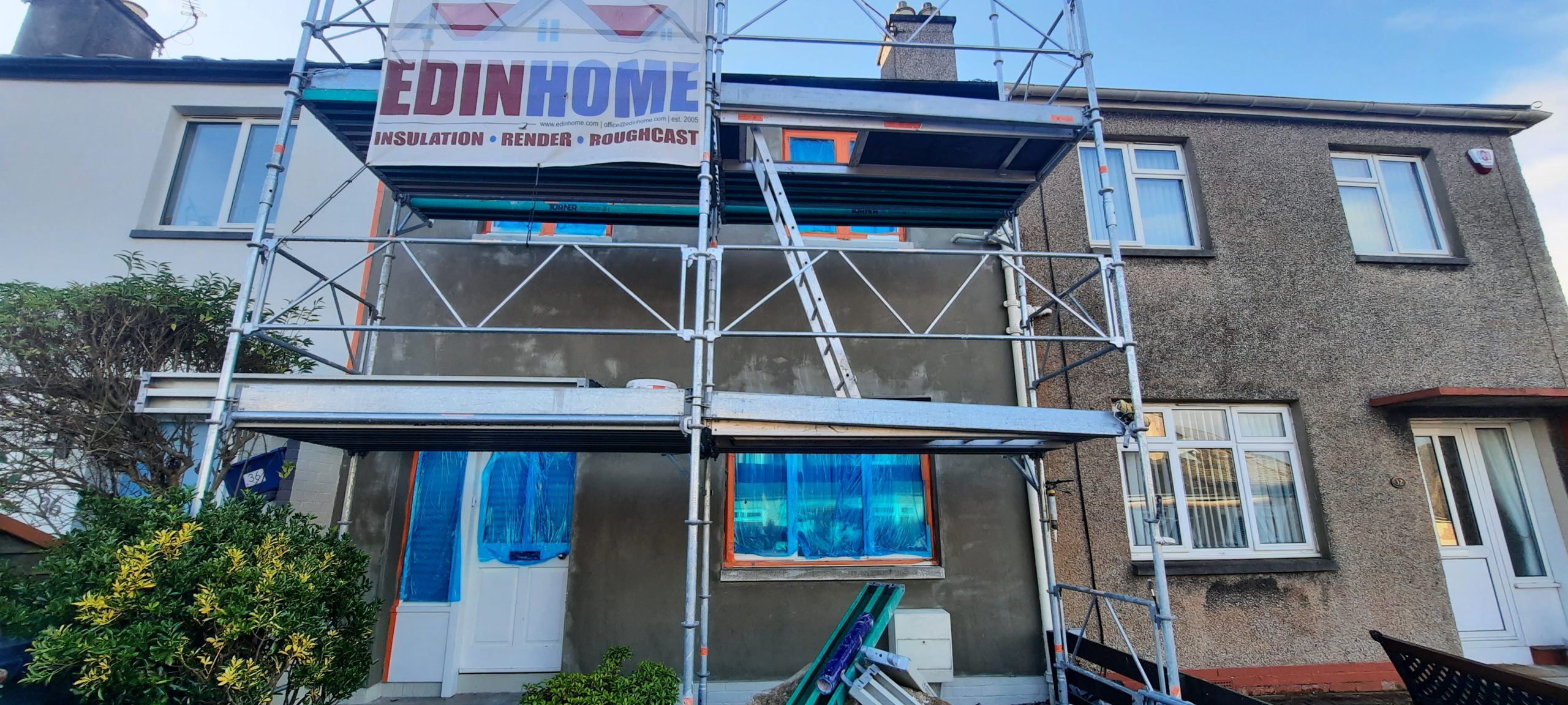 house rendering Edinburgh under scaffolding structure