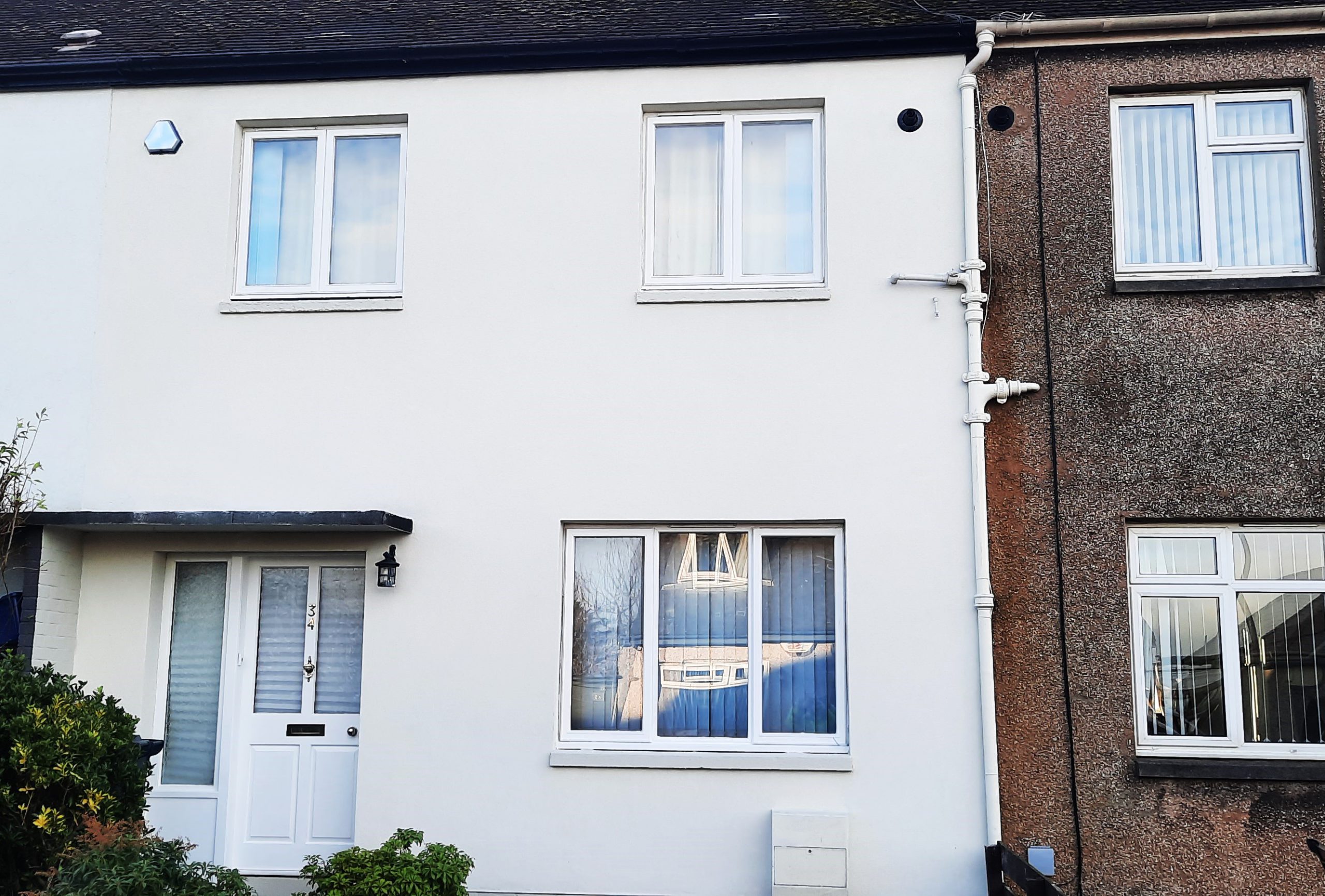 roughcast repair on renovated double fronted house