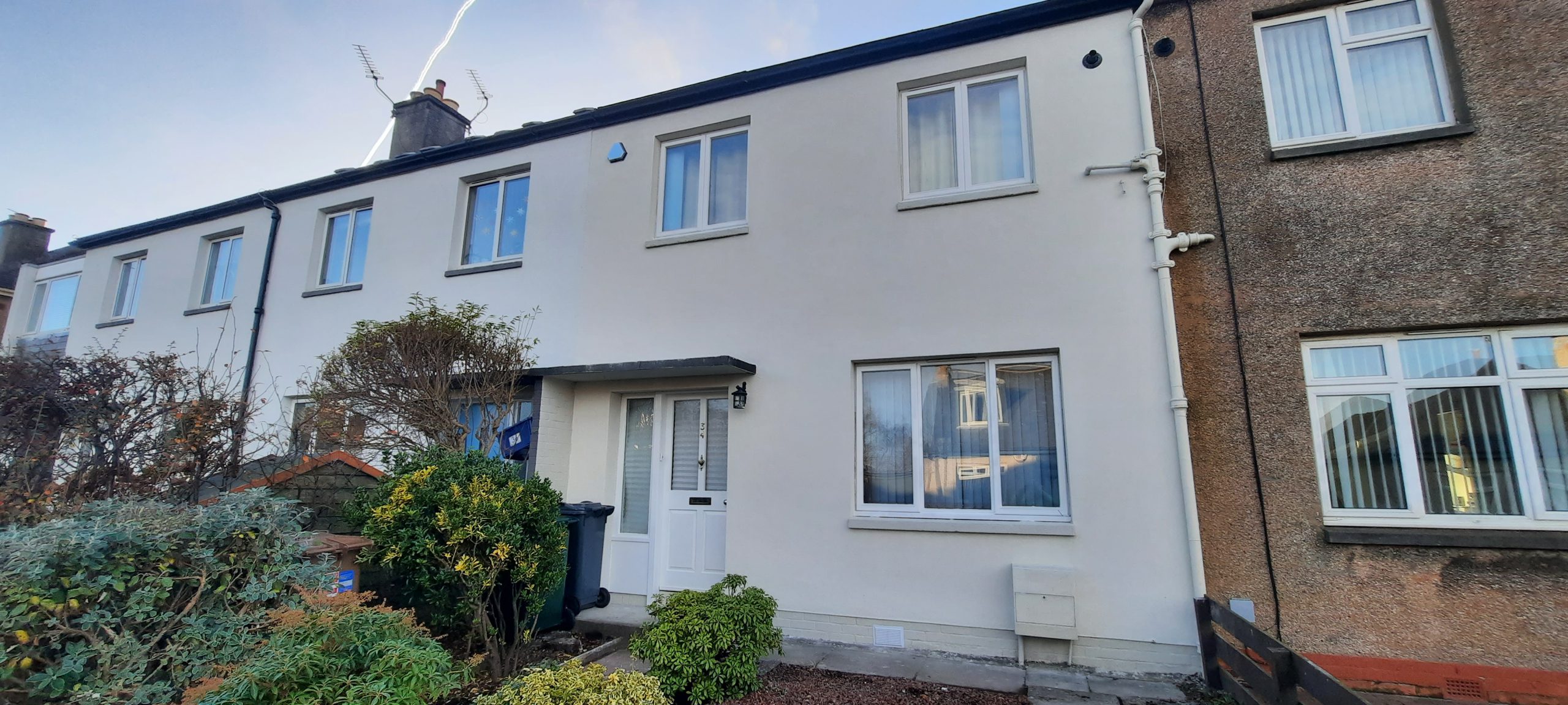 roughcast render repair front wall with new finish