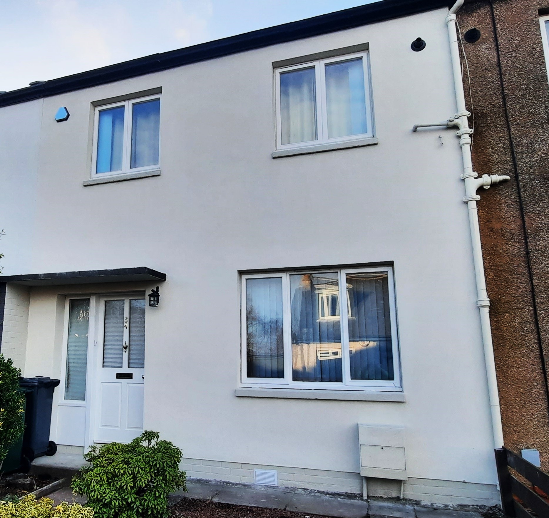 roughcaster Edinburgh work on white two-storey home