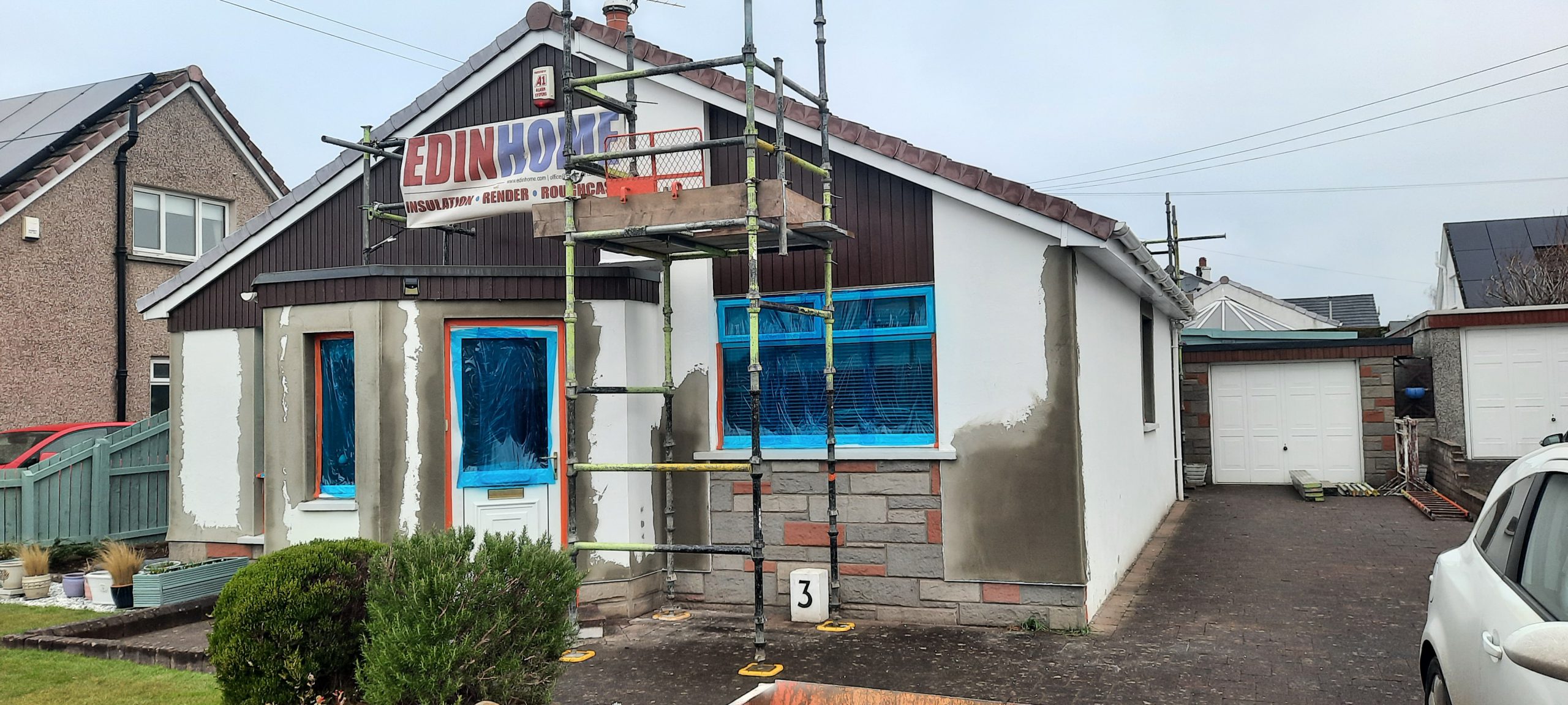 roughcast render repair on single-storey family home