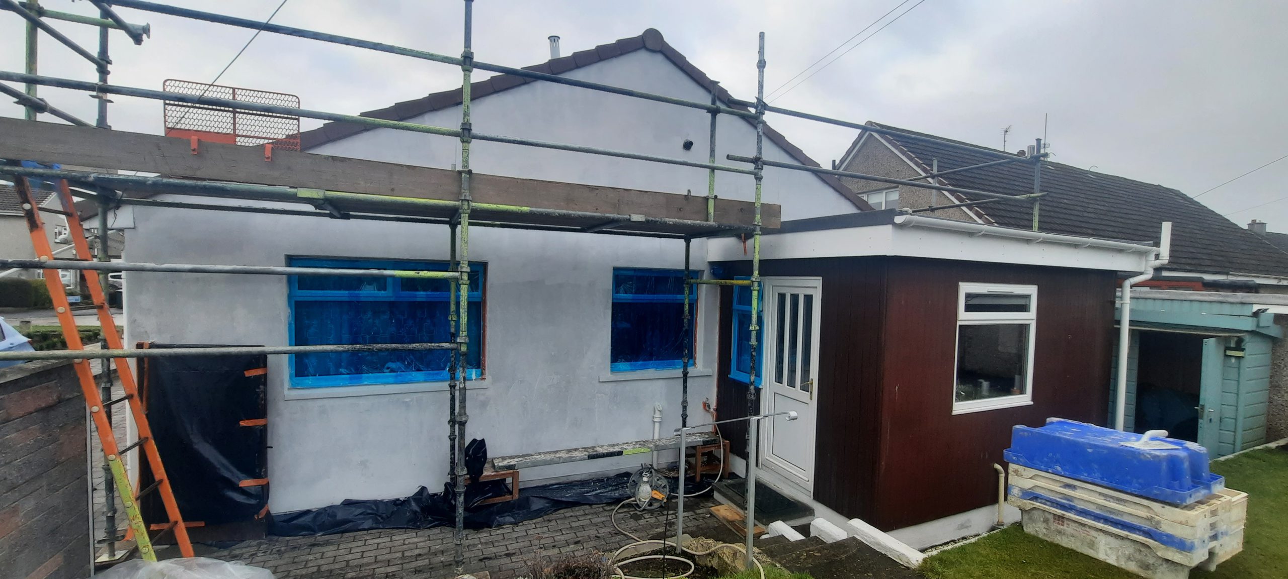 roughcasting Edinburgh on bungalow side wall