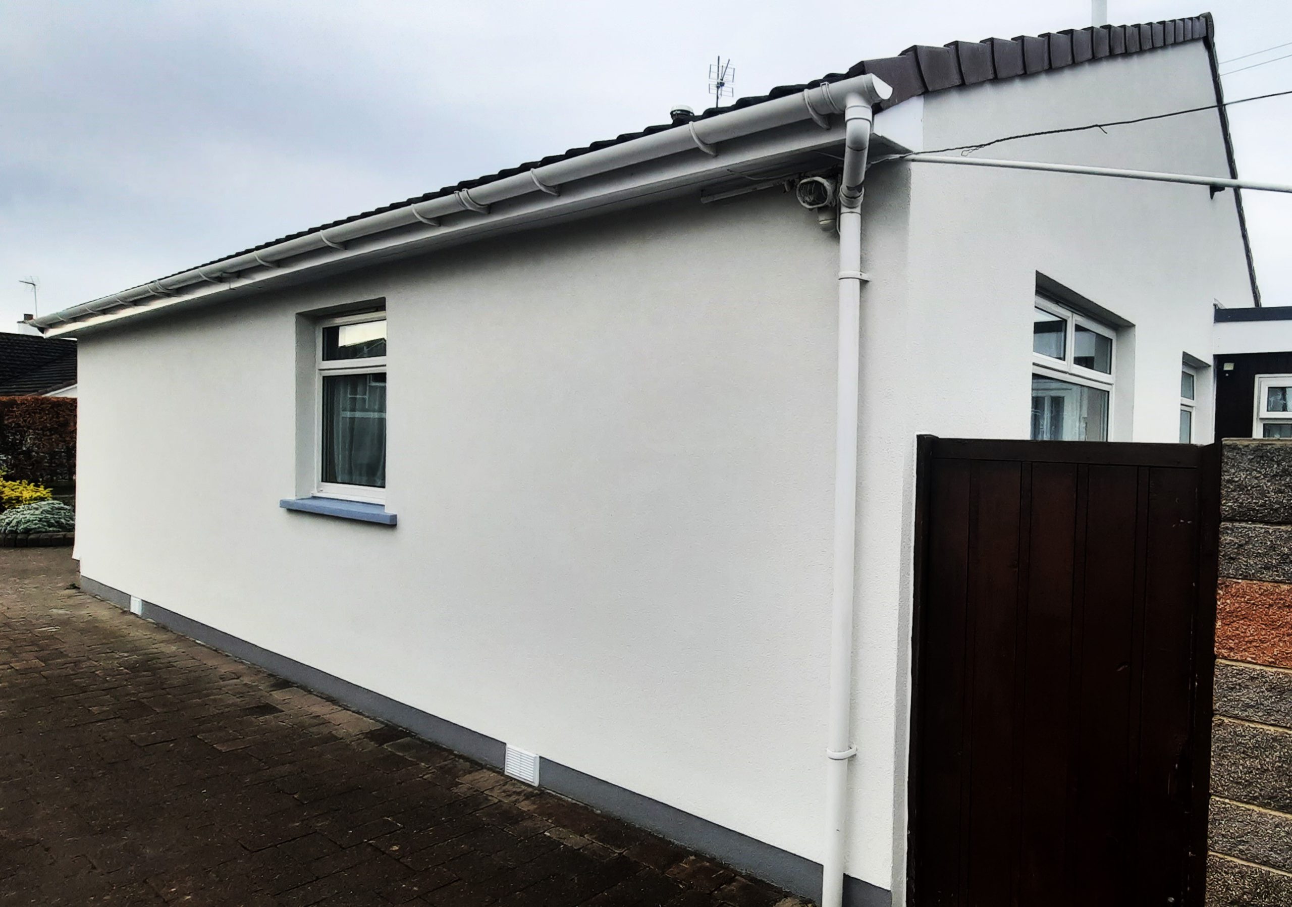 roughcast render repair on long side elevation