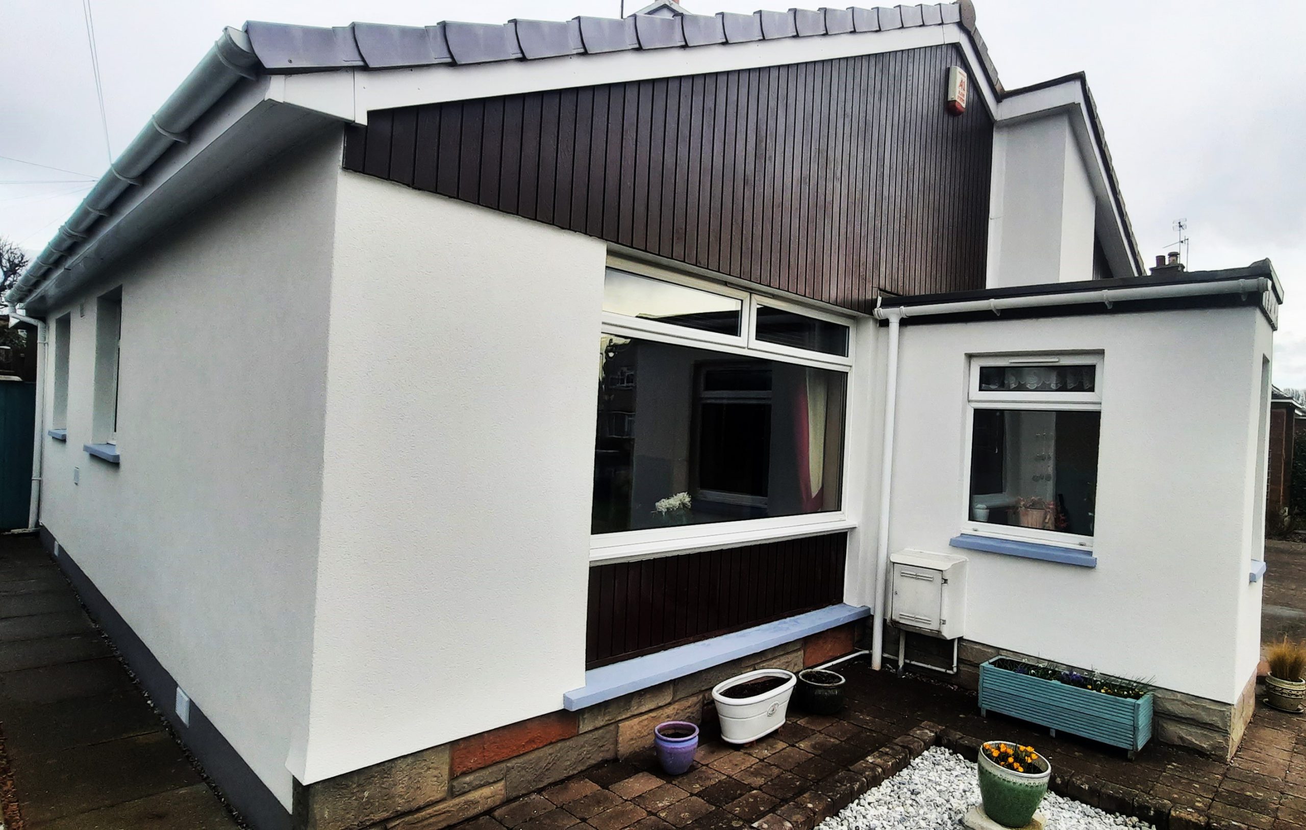 Insulation Edinburgh behind smooth white exterior