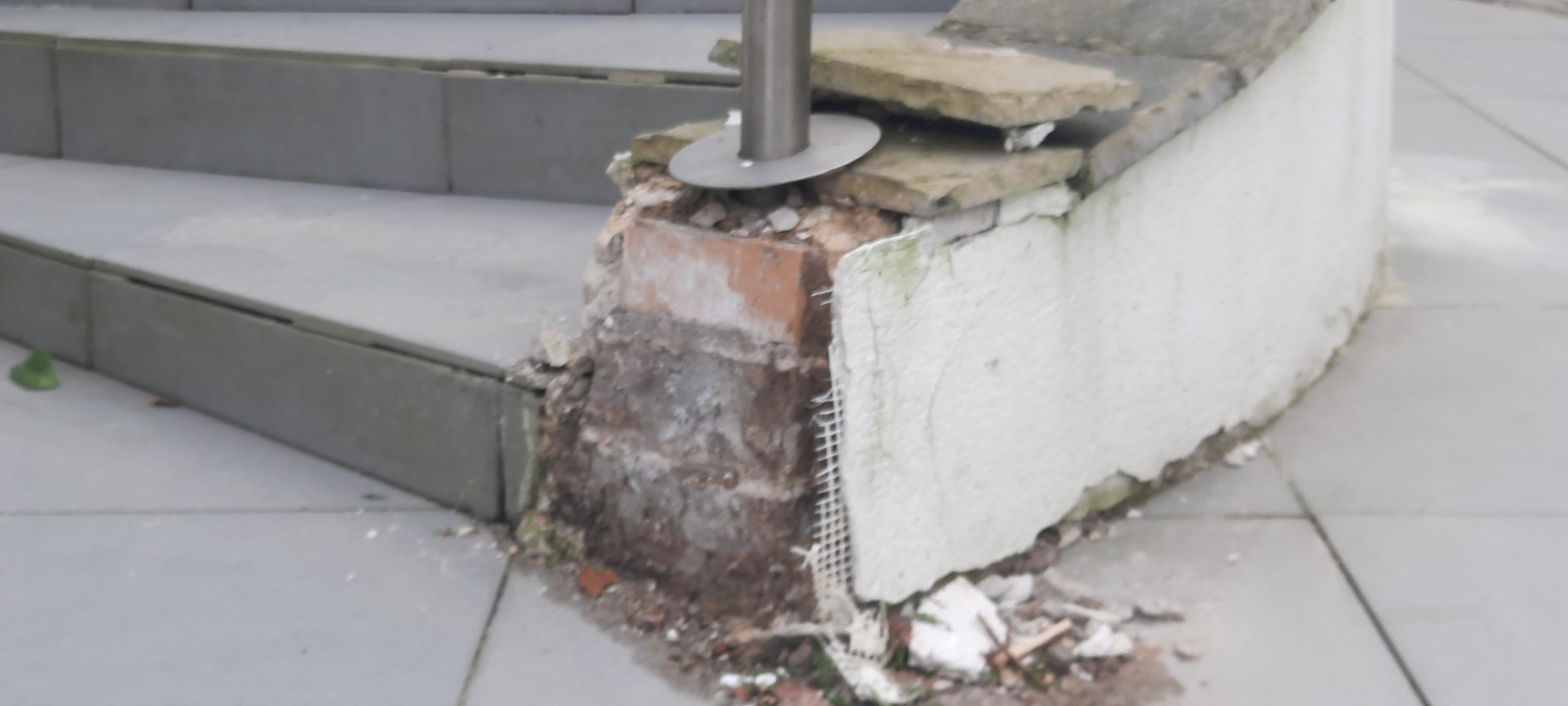 house rendering Edinburgh with damaged wall corner