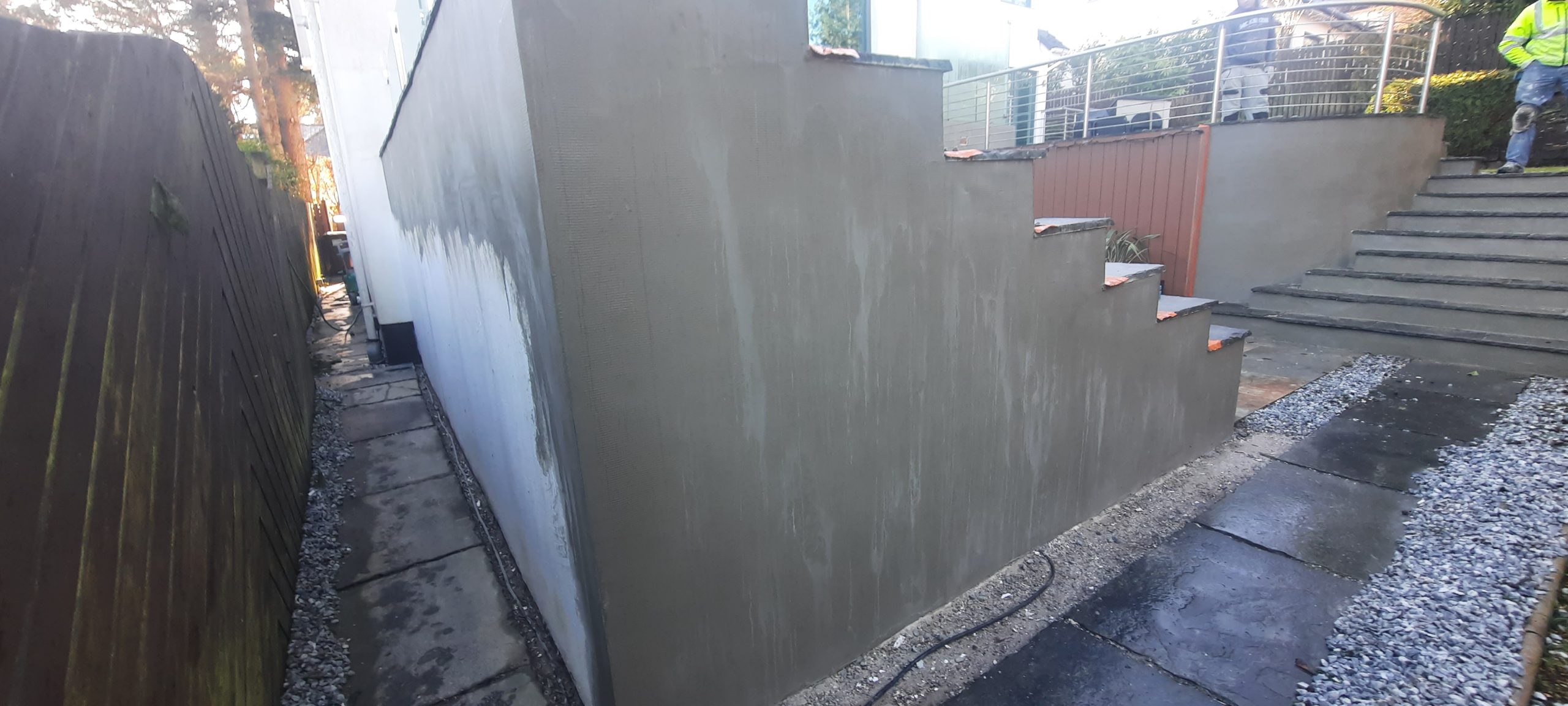 roughcast render Edinburgh applied to tall boundary wall