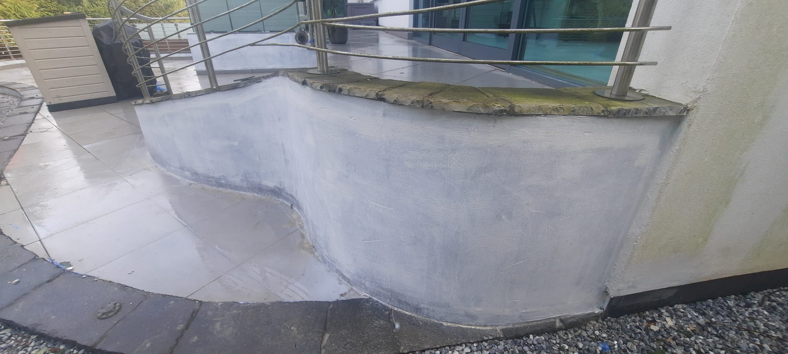 Rendering Edinburgh smooth finish on patio wall