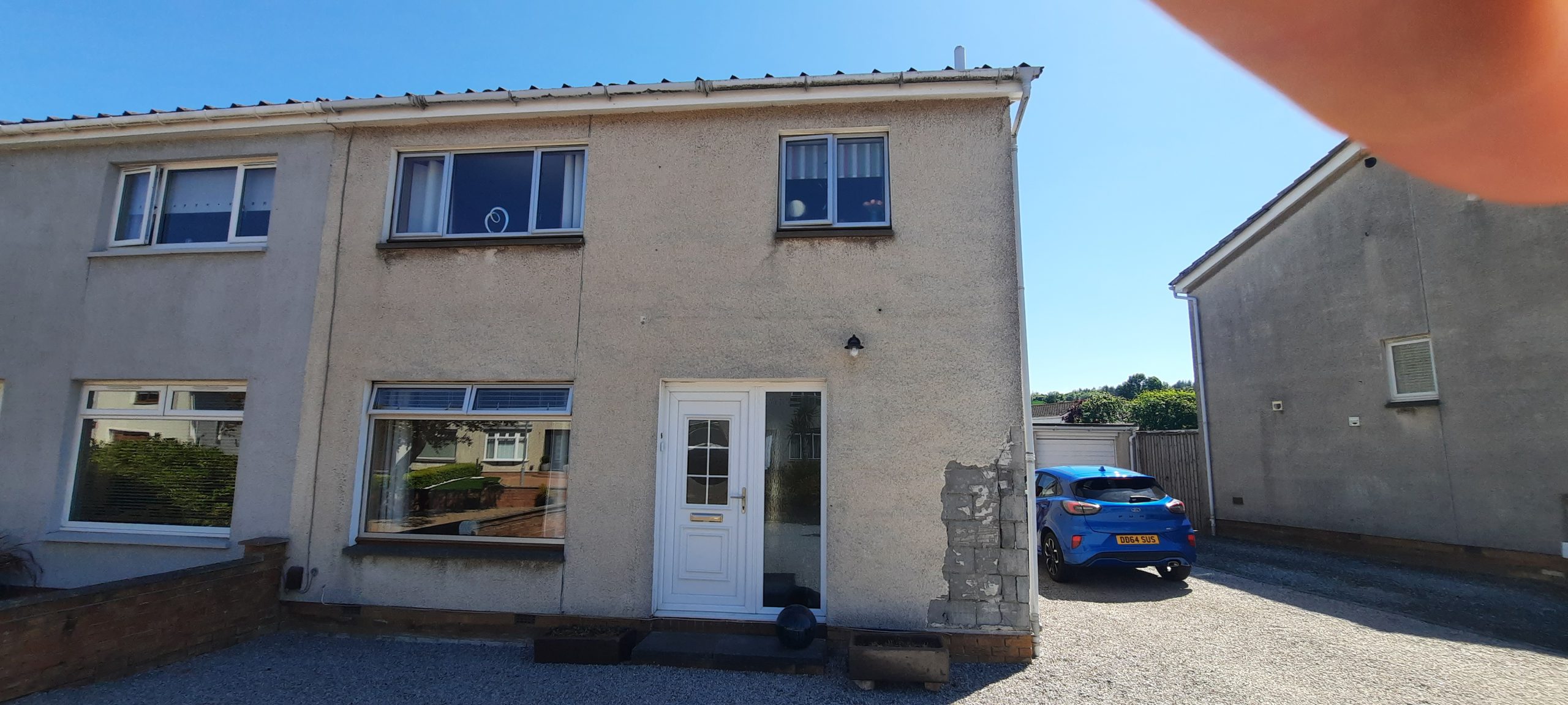 patchwork roughcast repair completed on lower section of exterior wall